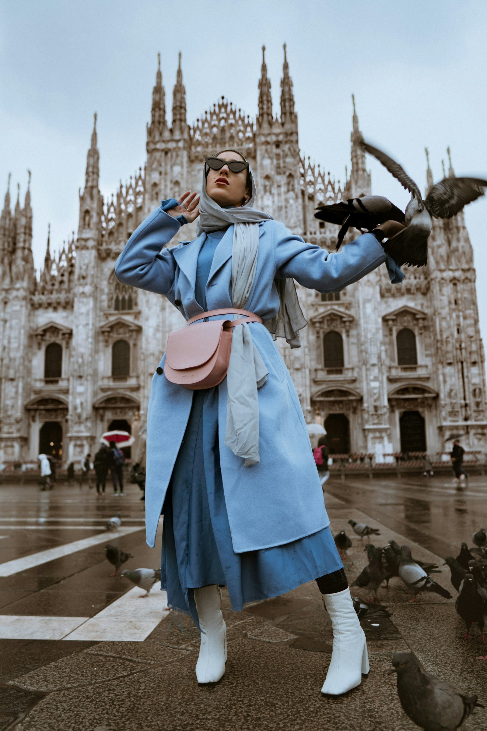 Woman wearing a powder-blue tailored coat in Milan